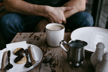 morning coffee with milk and cookies on a table