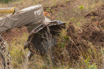 Forest restoration harvester makes furrows for planting spruce pine seedlings. Reforestation on the...