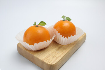Orange shaped cakes on a white background
