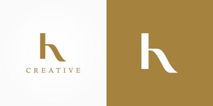 Initial Letter H Logo. Gold and White Shape Calligraphy Style isolated on Double Background. Usable for Business and Branding Logos. Flat Vector Logo Design Template Element.