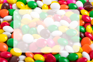 Huge pile of colorful coated chocolate candies background