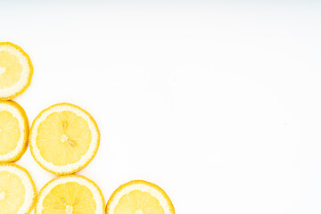 Fresh lemon slices with leaves isolated on white background.