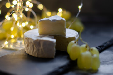 Camembert cheese with grapes