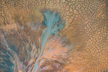 Drought Top View. Aerial view of a cracks in the ground. texture. Desert landscape.