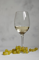 a glass of white wine with cheese Camembert