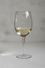 a glass of white wine with cheese Camembert