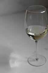 a glass of white wine with cheese Camembert