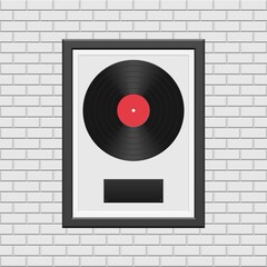 Vinyl record with black frame on white brick wall