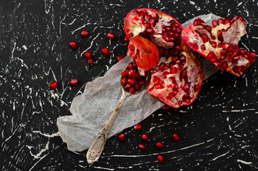 chopped pomegranate seeds on a black background