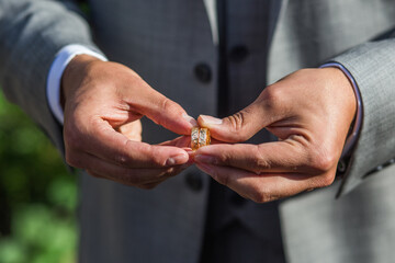 groom with wedding rings
