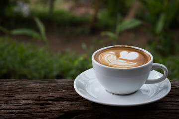 a cup of Cappuchino coffee  on wooden table