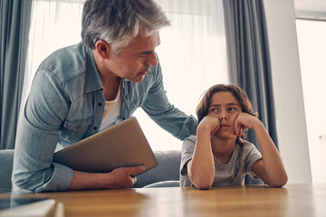 Parent and kid staying at home and discussing