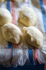 The process of cooking traditional vareniki - textured background. Rural East European cuisine. Dumplings with cottage cheese. Traditional dumplings, pierogi, varenyky