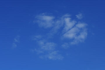 Light haze of clouds in a piercing blue sky