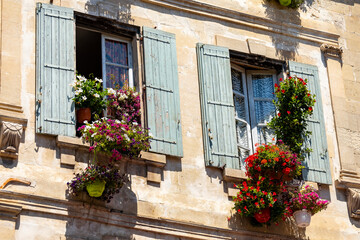 Fototapeta na wymiar balcony with flowers and windows in Aix-en-Provence
