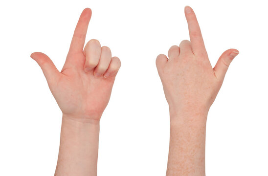 Freckled white hand make finger guns or pointing gesture, view from front and back.  Female hand isolated