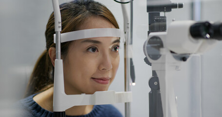 Woman check on eye in clinic