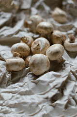 fresh champignon mushrooms on a clay plate