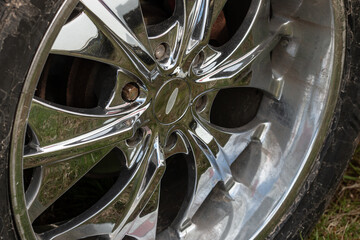 Detailed view of a shiny aluminum rim of an SUV