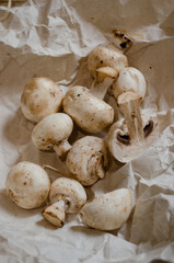 fresh champignon mushrooms on a clay plate