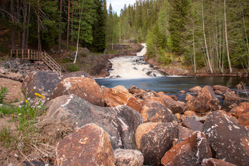 River landscape in the Swedish Vaermland with a stony river bed, taken with a long exposure