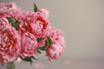 Fototapeta premium Flowers composition. Pink peony flowers on wooden background. Mothers day. Flat lay, top view.