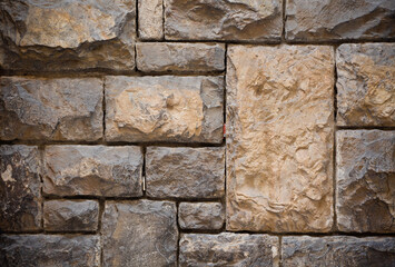 Different size brick masonry. Close up shot. Abstract texture or background.