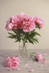 Flowers composition.  Pink peony flowers on wooden background. Mothers day. Flat lay, top view.