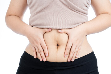 Fat woman holding excessive fat belly, overweight fatty belly isolated on over white background. Diet lifestyle, weight loss, stomach muscle, healthy concept.