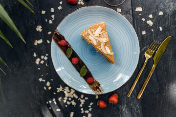 Waffle cake dessert made of crispy waffle cakes with boiled condensed milk on a gray background. Quick sweet dessert. with aperol spritz