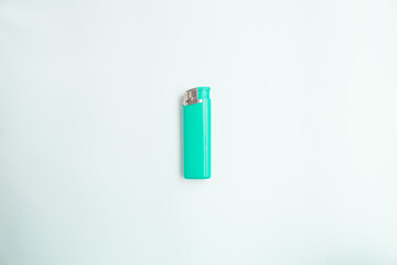  blue lighter with a button on a brown and white background. Top view. Mock up. Flat lay composition