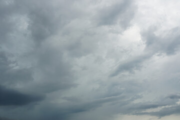 A stratocumulus cloud belongs to a genus-type of clouds characterized by large dark, rounded masses, usually in groups, lines, or waves