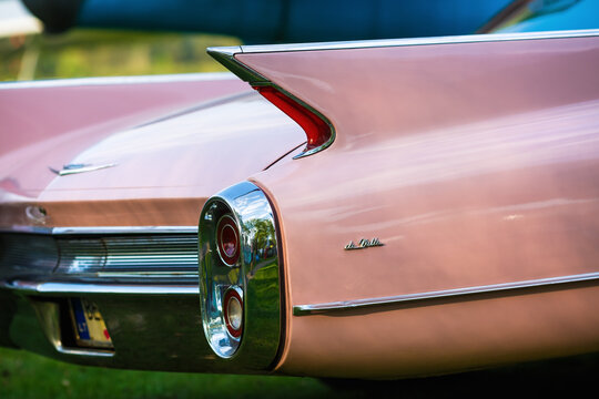 Minsk, Belarus - May 07, 2016: Close-up photo of pink Cadillac de Ville. Back view of retro car. Selective focus.