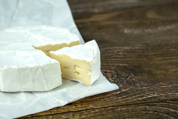 fresh cheese on a wooden background
