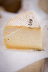 Heads of cheese. Hard cheese. Cheese. Cheese Festival. Craft cheese. A piece of hard cheese. 