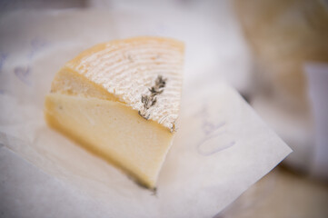 Heads of cheese. Hard cheese. Cheese. Cheese Festival. Craft cheese. A piece of hard cheese. 