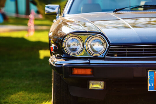 Minsk, Belarus - May 07, 2016: Close-up photo of black Jaguar XJS 1984 model year. Close-up of the front part of an old black classic retro car. Selective focus.