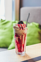 A glass with delicious coffee ice cream red shake