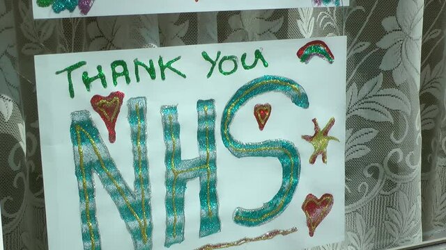 Thank you NHS, kids drawings in shop window. Corona virus, Covid-19 pandemic. UK in Lockdown. Stay indoors, protect the NHS, save lives. Filmed East Yorkshire, England UK.