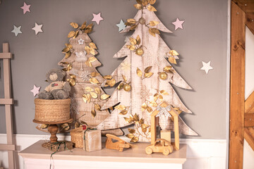 Merry Christmas. New year's interior with a fireplace, Christmas lights, paintings, deer and firewood.