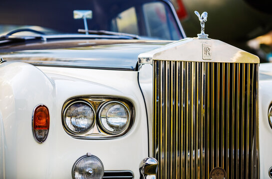 Minsk, Belarus - May 07, 2016: Rolls-Royce Silver Cloud. Close-up photo of Rolls Royce. Close-up of the front part of the luxury retro car. Selective focus on the headlight.