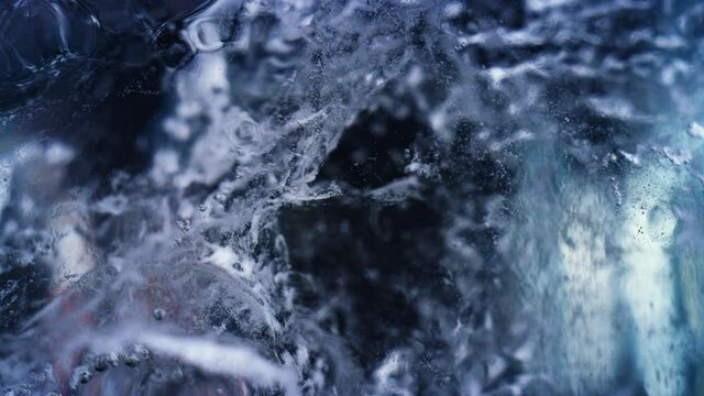 Blue underwater bubbling ice macro texture background