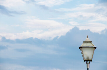 Fototapeta na wymiar Outdoor candelabra street light pole against the sky