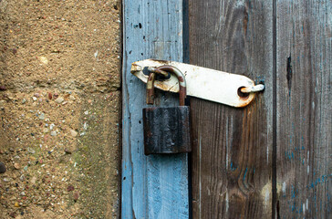 The barn castle hangs on an old wooden barn