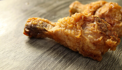 two chicken drumstick on table, look hot and delicious