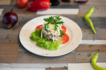 Salad on a white plate. beautiful feed