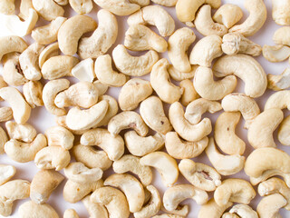 White raw cashew nuts in a white background stock image.
