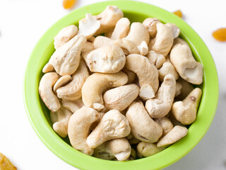 White raw cashew nuts in a white background stock image.
