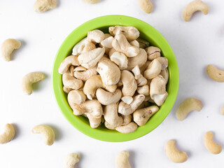 White raw cashew nuts in a white background stock image.
