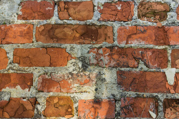 Red brick wall background. Old and broken brick.